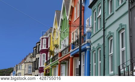 Yellow Red Orange Green Blue Sky Houses By The Sea Whitehead In N. Ireland
