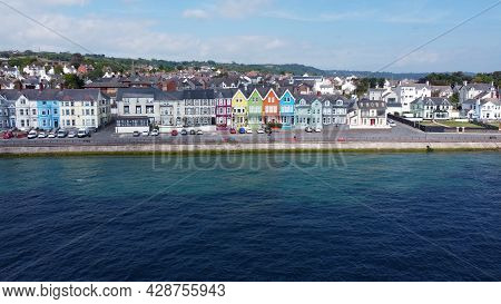 Aerial Video Of Yellow Red Blue Green Orange Painted Houses By The Sea Whitehead N. Ireland