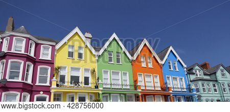 Aerial Video Of Yellow Red Blue Green Orange Painted Houses By The Sea Whitehead N. Ireland