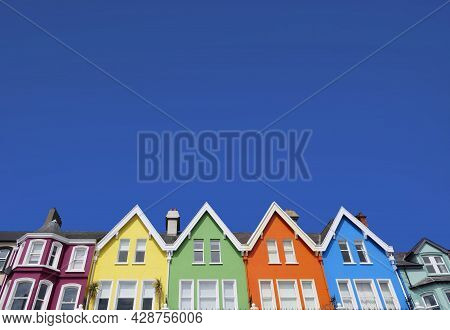 Aerial Video Of Yellow Red Blue Green Orange Painted Houses By The Sea Whitehead N. Ireland