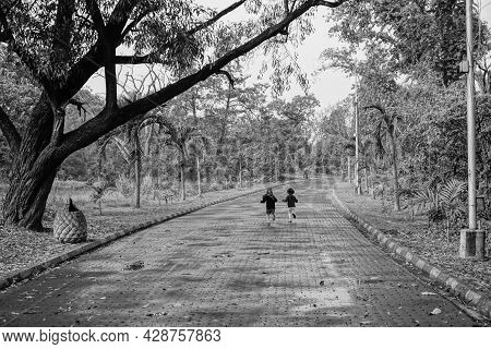 Little Boy And Girl Running In Joy In Natural Environment, Black And White Photograph Of Childhood F