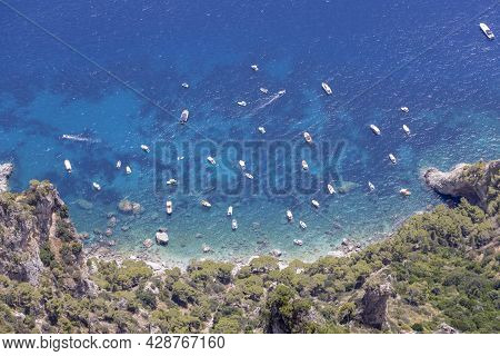 Aerial View Of Rocky Shoreline On The Tyrrhenian Sea Nearby Marina Piccola, A Lot Of Sailing Tourist