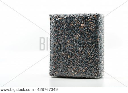 Pack Of Black Glutinous Rice On White Background, Black Glutinous Rice In Vacuum-sealed For Sale, Fr