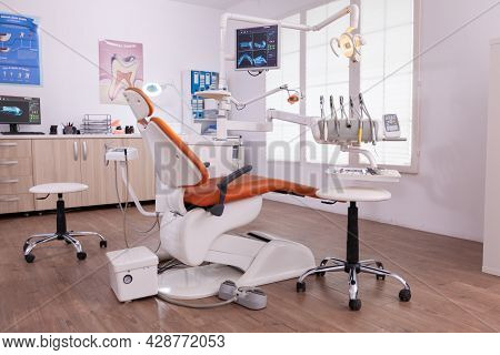 Empty Modern Teethcare Stomatology Hospital Office With Nobody In It Equipped With Dental Intruments