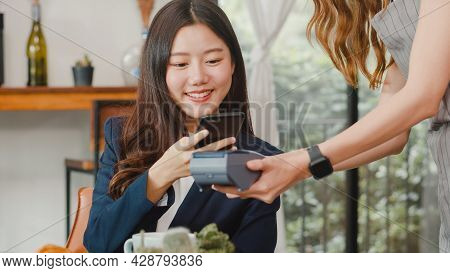 Young Asian Business Women Pay Contactless At Coffee Shop. Asian Happy Girl Barista Waiter Wear Gray