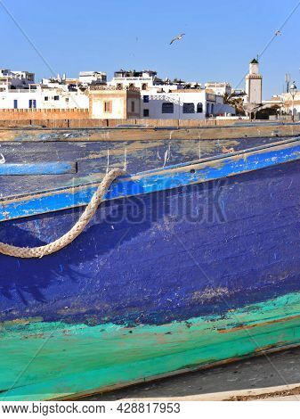 Close Up Of Bright Blue Fishing Boat In Harbour With Ramparts In Background, Essaouira, Morocco
