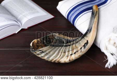 Shofar, Tallit And Open Torah Book On Wooden Table. Rosh Hashanah Holiday Attributes