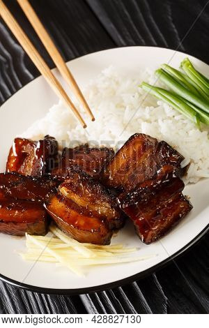 Rafute Okinawan Braised Pork Belly With Rice Closeup In The Plate On The Table. Vertical