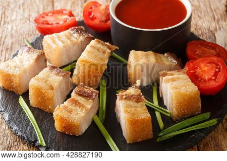 Lechon Kawali Is A Popular Filipino Pork Dish Deep-fried To Golden Perfection With A Dipping Sauce C