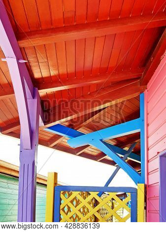 View From Below Of Brightly Colored Wooden Roof And Porch In The Fwi. Close Up Of A Wooden Structure
