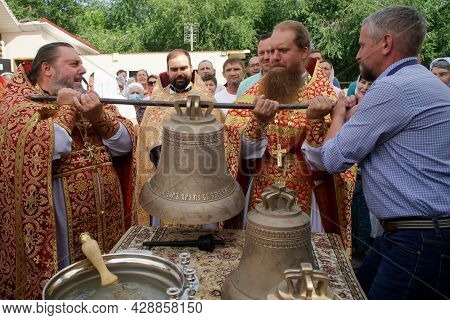 Orthodox Priests Are Preparing To Raise The Bell To The Bell Tower Of A Christian Church. Faith And 