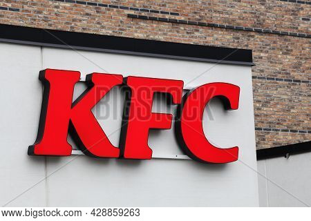 Horsens, Denmark - May 13, 2021: Kfc Logo On A Facade. Kfc Is A Fast Food Restaurant Chain That Spec