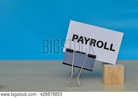 White Paper With Text Payroll Isolated On Blue Background