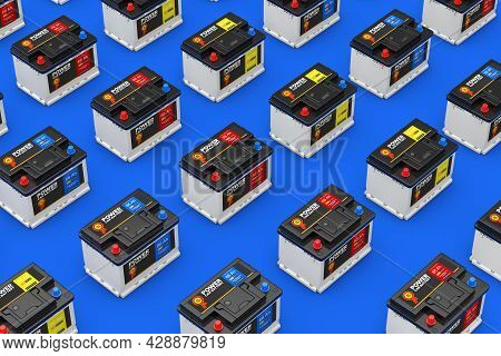 Rows Of Rechargeable Car Battery 12v Accumulators With Abstract Label On A Blue Background. 3d Rende