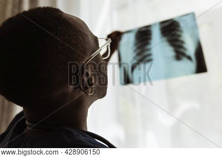 Close-up Portrait Of African Young Doctor, Therapeutic Or Medical Advisor At Work, Idoors . Concept 