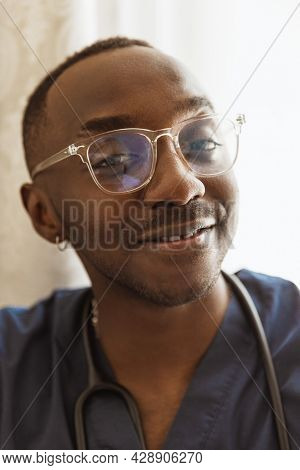 Close-up Portrait Of African Young Doctor, Therapeutic Or Medical Advisor At Work, Idoors . Concept 