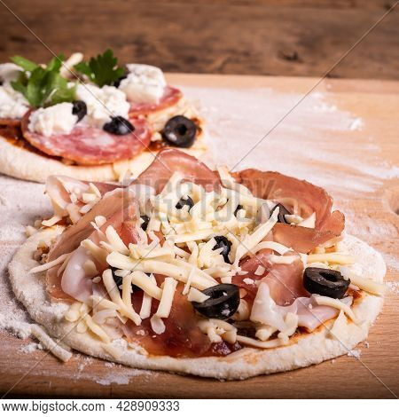 Cooking Mini Pizza - Mini Pizza With Ham, Olives And Mozzarella Cheese, Close-up