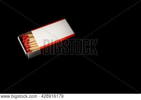 Open Matchbox With Blank White Label Isolated On Dark Background.