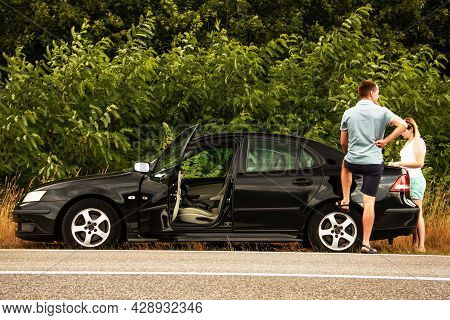 Chernigov, Ukraine - July 24, 2021: Saab Car And People On The Road. Black Saab 9-3 Car On The Backg