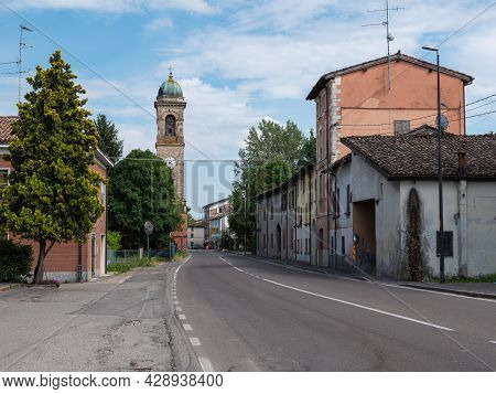 Parma, Italy - June 2021: View Of The Via Emilia Road With Bell Tower Of The Church Of San Giacomo A
