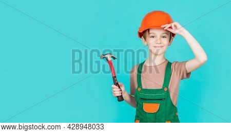 Child Dressed As A Workman Builder. Little Boy Wearing Helmet. Portrait Little Builder In Hardhats H