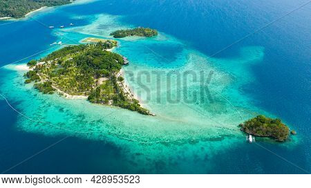 Top View Of Small Tropical Island In The Blue Sea With A Coral Reef And The Beach. Malipano Island, 