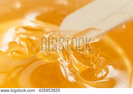 Sugar Paste Or Wax Honey In A Transparent Jar On A White Background. Sugaring. Depilation And Beauty