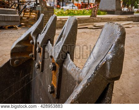 Excavator Bucket Theeth In Construction Site In Street