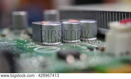 Semiconductor. Cpu Chip Located On The Green Motherboard Of The Computer.