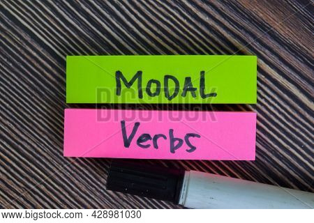 Modal Verbs Write On Sticky Notes Isolated On Wooden Table.