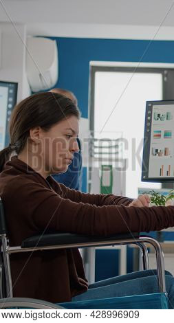  Paralysed Handicapped Woman Entrepreneur Using Computer And Tablet In Same Time Checking Sta