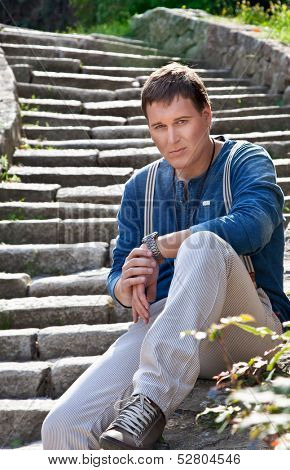 Young urban male model against city street. Novi Sad, Serbia.