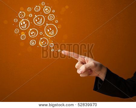 Group of happy hand drawed smiley faces coming out of gun shaped hands