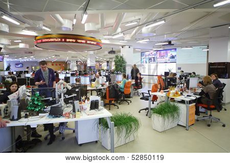 MOSCOW - MAR 5: Employees work in office buildings news agency RIA Novosti with green grass  and many screens on March 5, 2013 in Moscow, Russia.