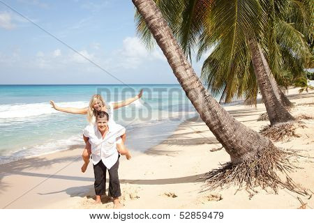 Happy Couple On The Beach