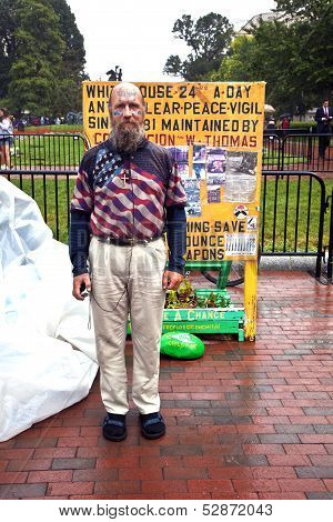 Man Is Demonstration In Front Of The White House In Rain For Peace And Against Nuclear Wapons