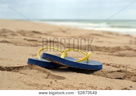 Slippers in the beach.