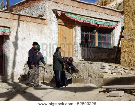 Children Are Elderly Parents In The Temple. Shigatse, China, Tibet, September 2011