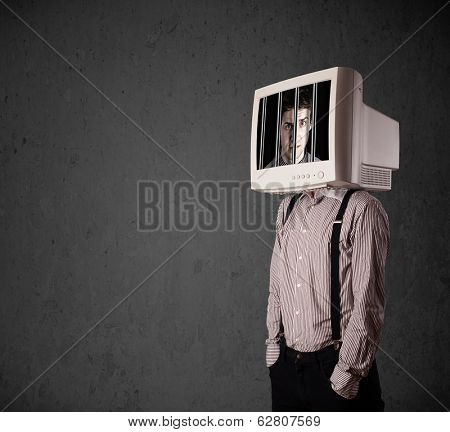 Business man with monitor screen on his head traped into a digital system concept