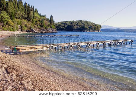 Mooring jetties  in the charming cove of Agni, on the north-eastern coast of Corfu, Greece.