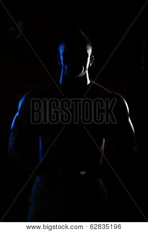 Siluet Young Muscular Man Flexing Muscles