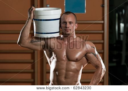 Bodybuilder Posing With Supplements For Copy Space