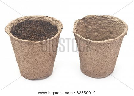 pile peat pots for growing seedlings, isolated on white background 