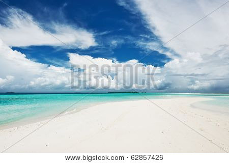 Beautiful island beach with sandspit at Maldives