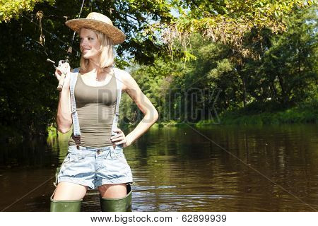 woman fishing in Jizera river, Czech Republic