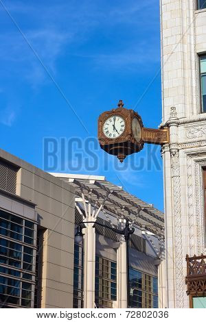 Clock on the corner of historic building in Washington DC