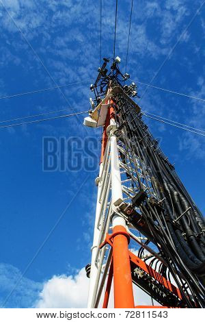 High Mast Metal Structure Telecommunication On Tower With Blue Sky.