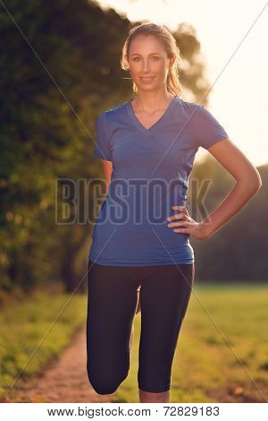 Young Woman Doing Stretching Exercises