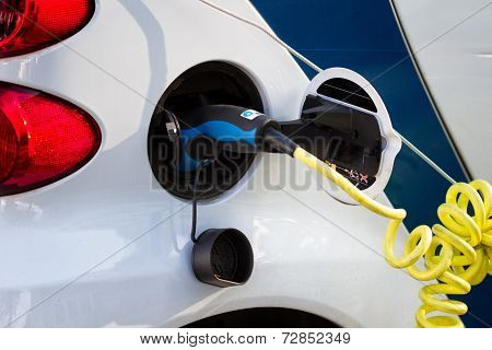 White Electric Car During Refueling
