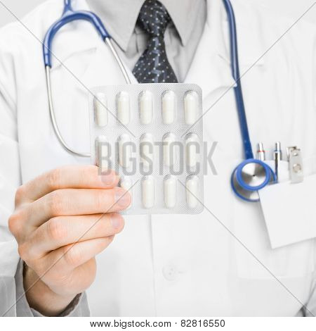 Doctor Holdling Pills In His Hand - Heath Care Concept